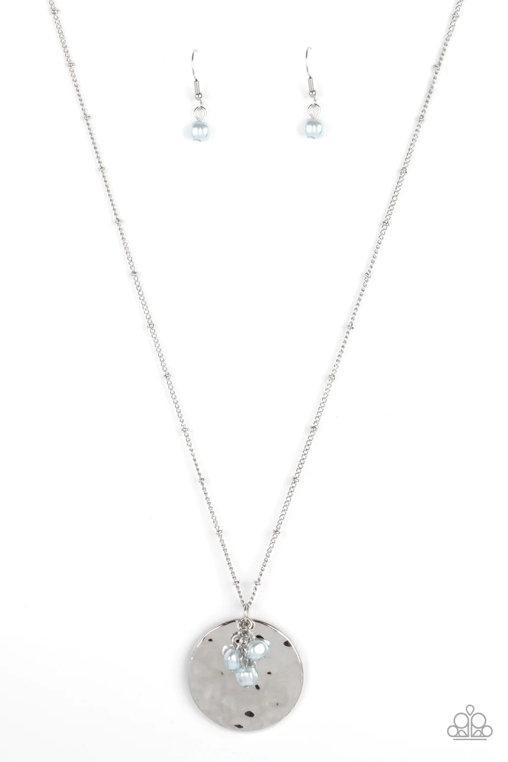 Paparazzi Accessories Seaside Shimmer - Blue A shimmering wavy silver disc sways from the bottom of a lengthened silver satellite chain. A cluster of Cerulean pearl beads dangles charmingly in front of the disc creating a tranquilly mystical pendant. Feat