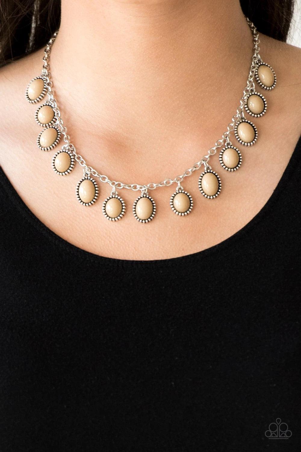 Paparazzi Accessories Make Some ROAM! - Brown Infused with studded silver frames, round and oval brown beads swing from a shimmery silver chain, creating a colorful fringe below the collar. Features an adjustable clasp closure. Sold as one individual neck