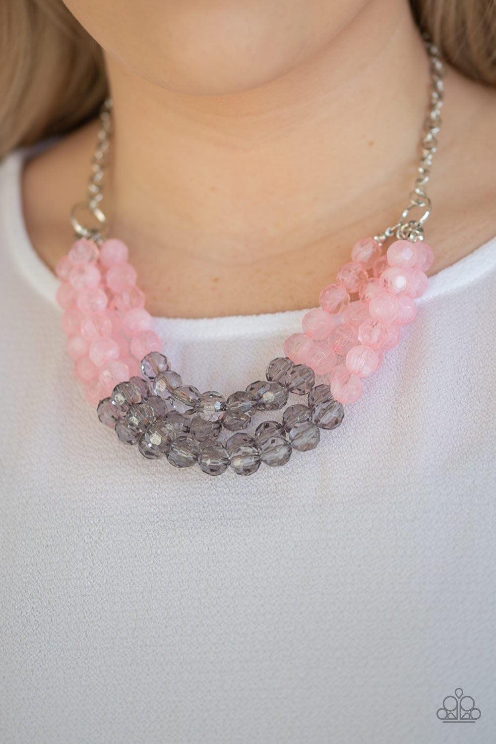Paparazzi Accessories Summer Ice - Pink Featuring cloudy and glassy finishes, strands of faceted pink and gray crystal-like beads alternate below the collar, creating colorfully icy layers. Features an adjustable clasp closure. Sold as one individual neck