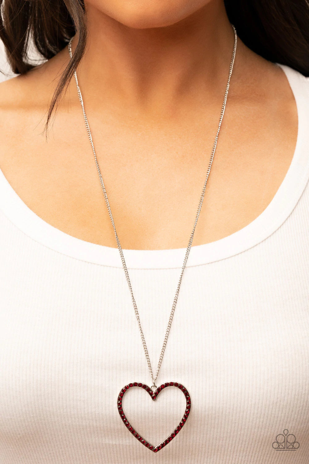 Paparazzi Accessories Va-Va-VALENTINE - Red An oversized silver heart frame is embellished with fiery red rhinestones, resulting in a flirtatious pendant at the bottom of an extended silver chain. Features an adjustable clasp closure. Sold as one individu