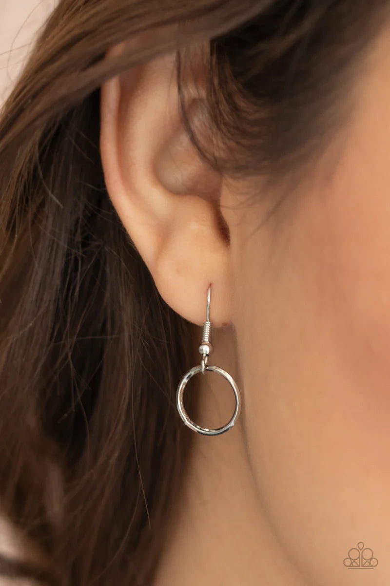 Paparazzi Accessories Revolutionary Radiance - Silver Dainty silver hoops and rings delicately link into a chic chain, creating simplistic shimmer below the collar. Features an adjustable clasp closure. Sold as one individual necklace. Includes one pair o