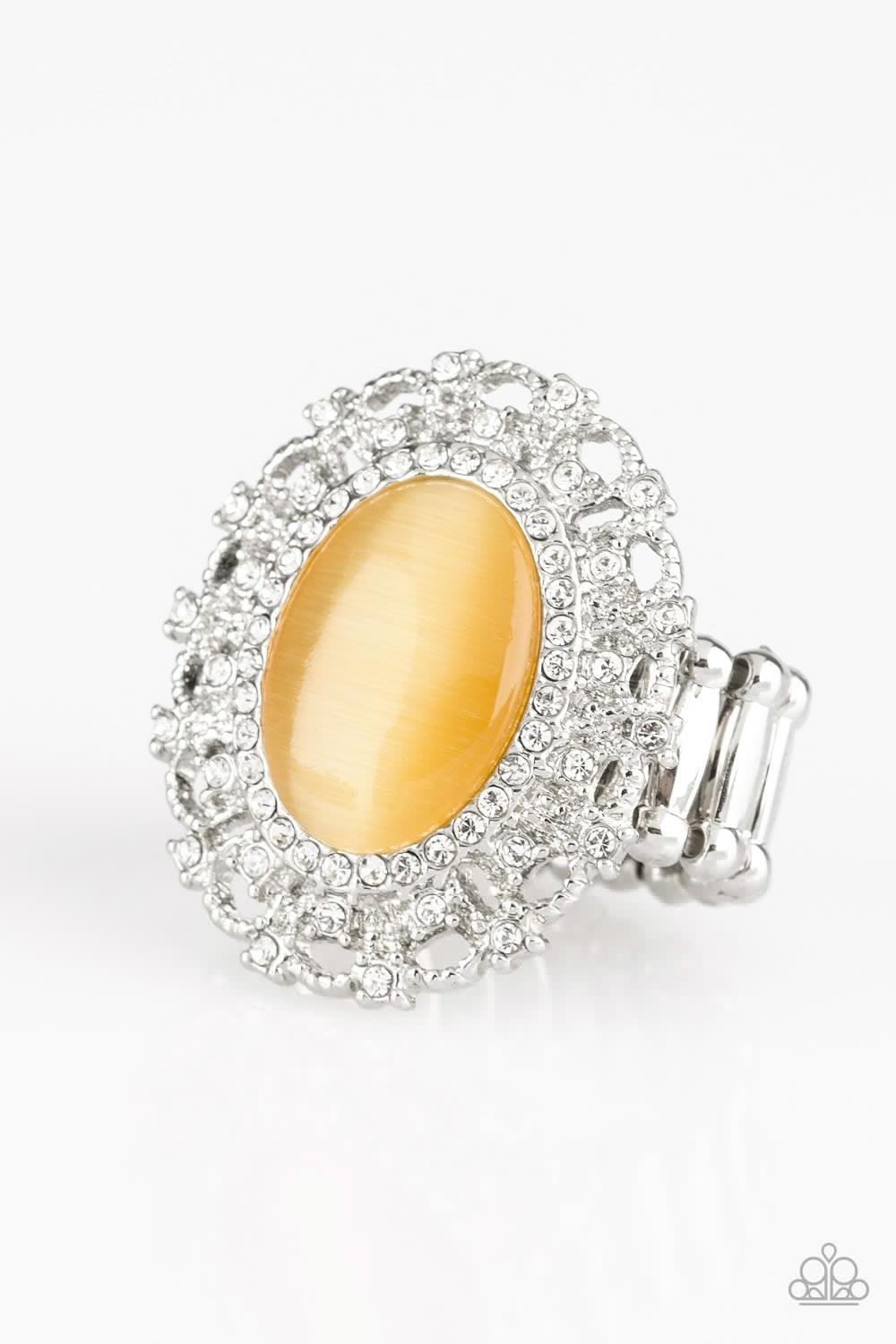 Paparazzi Accessories BAROQUE The Spell - Yellow Encrusted in dainty white rhinestones, a frilly silver frame spins around a glowing yellow moonstone center for a regal look. Features a stretchy band for a flexible fit. Jewelry