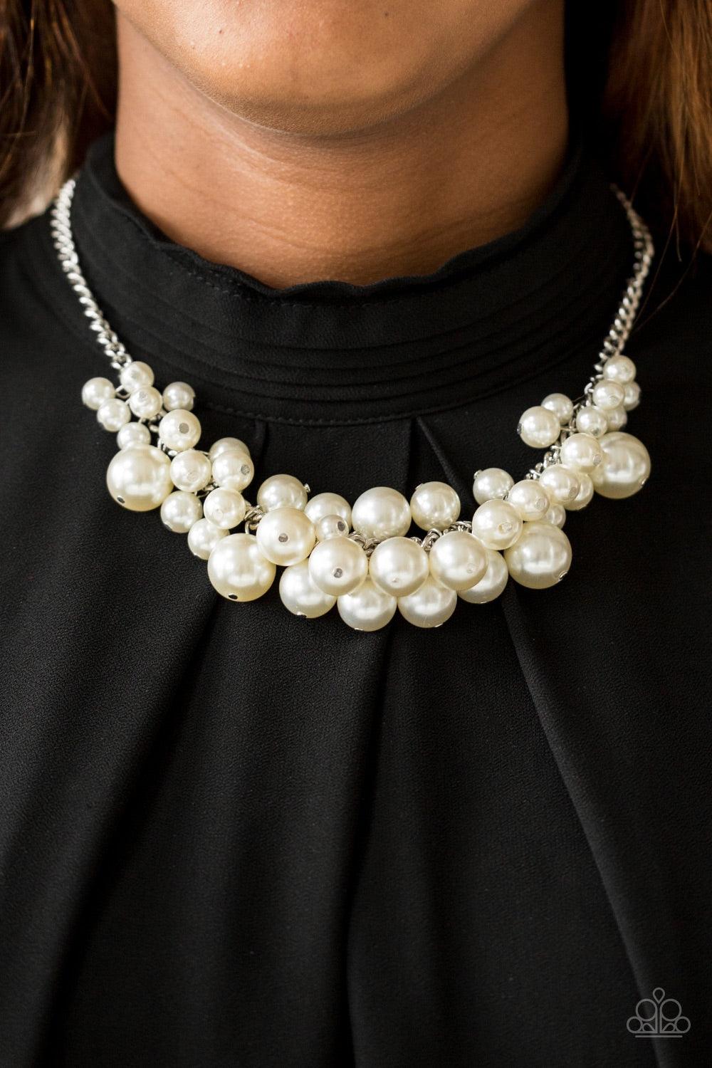 Paparazzi Accessories Glam Queen - White Varying in size, bubbly white pearls cascade from the bottom of a bold silver chain, creating a dramatically clustered fringe below the collar. Features an adjustable clasp closure. Jewelry