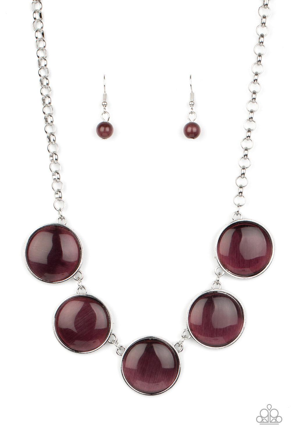 Paparazzi Accessories Ethereal Escape - Purple Featuring sleek silver fittings, a collection of round purple cat's eye stone pendants link below the collar for a colorfully ethereal look. Features an adjustable clasp closure. Sold as one individual neckla