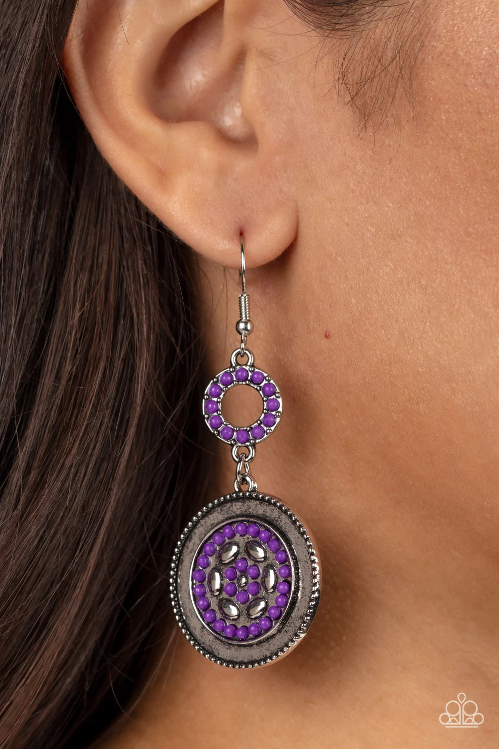 Paparazzi Accessories Meadow Mantra - Purple Dotted in dainty purple seed beads, a dainty silver hoop links to an ornate silver disc for a colorful floral finish. Earring attaches to a standard fishhook fitting. Sold as one pair of earrings. Earrings