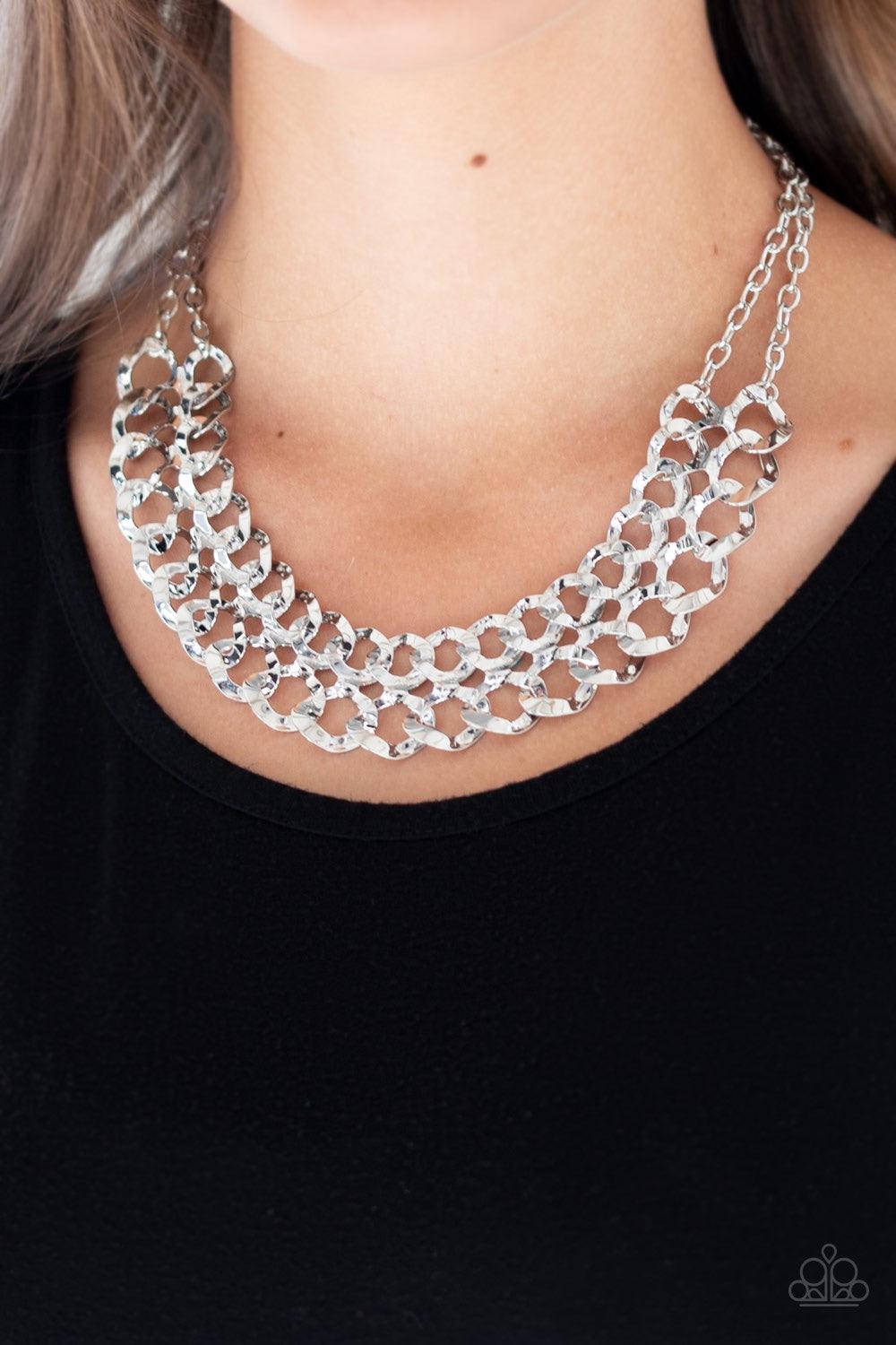 Paparazzi Accessories Street Meet And Greet ~Silver Asymmetrical silver frames connect below the collar, creating a bold web-like fringe for a statement-making look. Features an adjustable clasp closure. Jewelry
