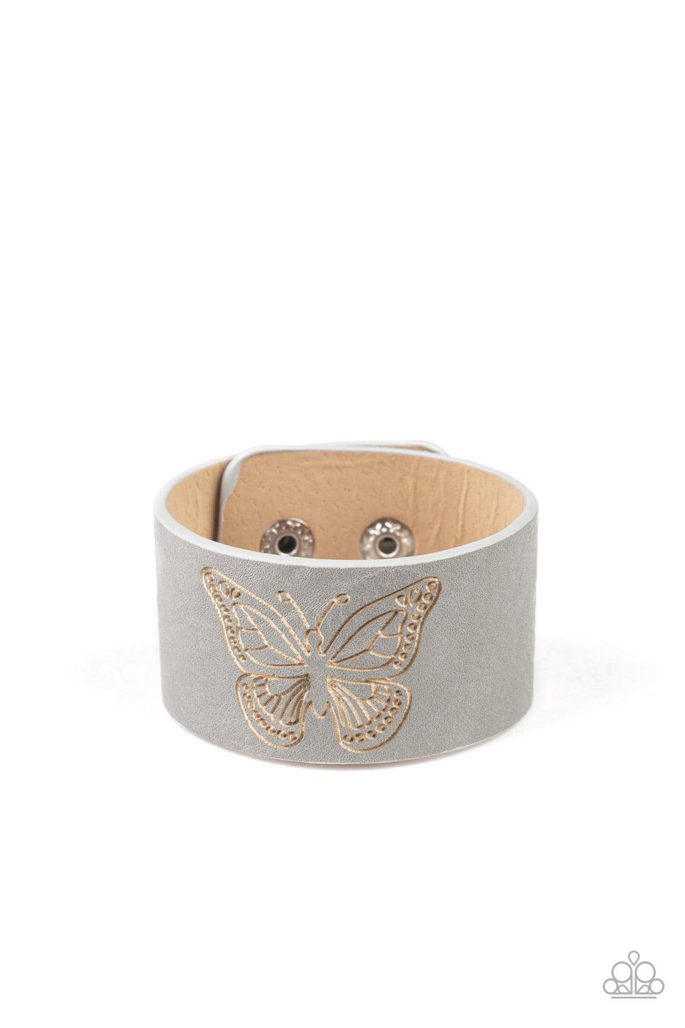 Paparazzi Accessories Flirty Flutter - Silver Stamped in a whimsical butterfly, a rustic piece of gray leather wraps around the wrist for a seasonal flair. Features an adjustable snap closure. Sold as one individual bracelet. Jewelry