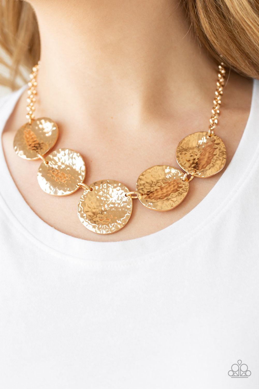 Paparazzi Accessories First Impressions - Gold Featuring a hammered high-sheen finish, imperfect round gold frames link below the collar for a casual look. Features an adjustable clasp closure. Jewelry