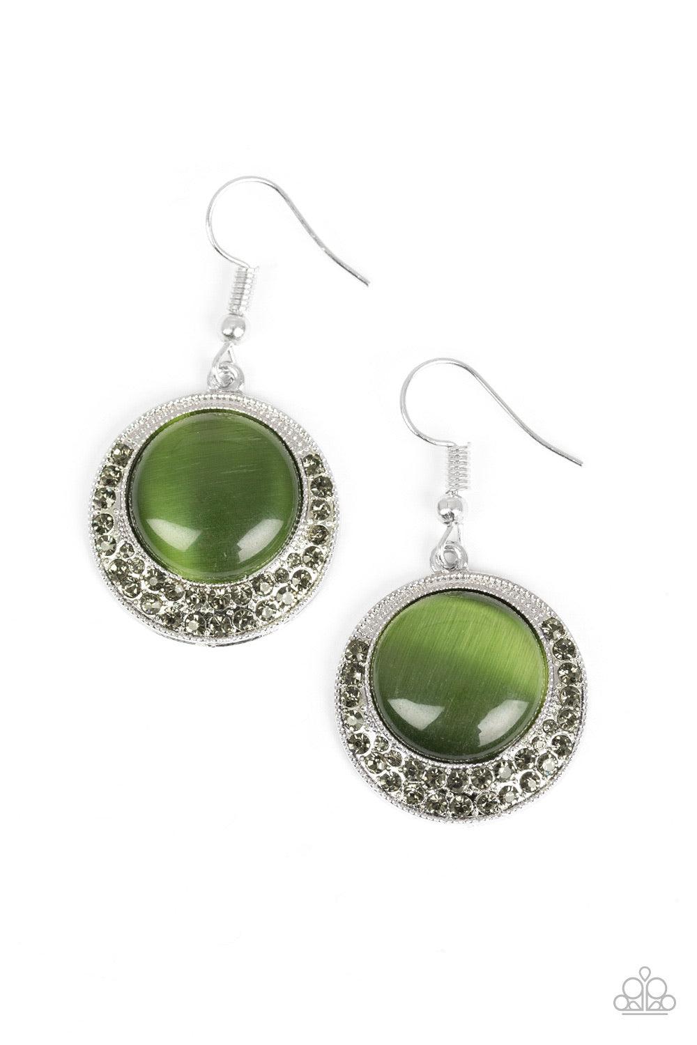 Paparazzi Accessories Gleam Away - Green As if dipped in glitter, the bottom of a silver frame is encrusted in smoky rhinestones. A glowing green moonstone is pressed into the center of the frame for a whimsical finish. Earring attaches to a standard fish