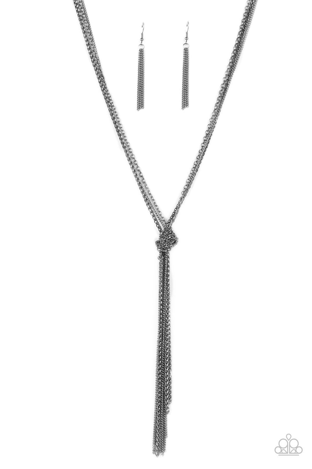 Paparazzi Accessories KNOT All There - Black Strands of long glistening gunmetal chains in round, delicate, and classic styles are pulled together in a sassy knot creating a show-stopping fringe pendant tassel and a flirty finish. Features an adjustable c