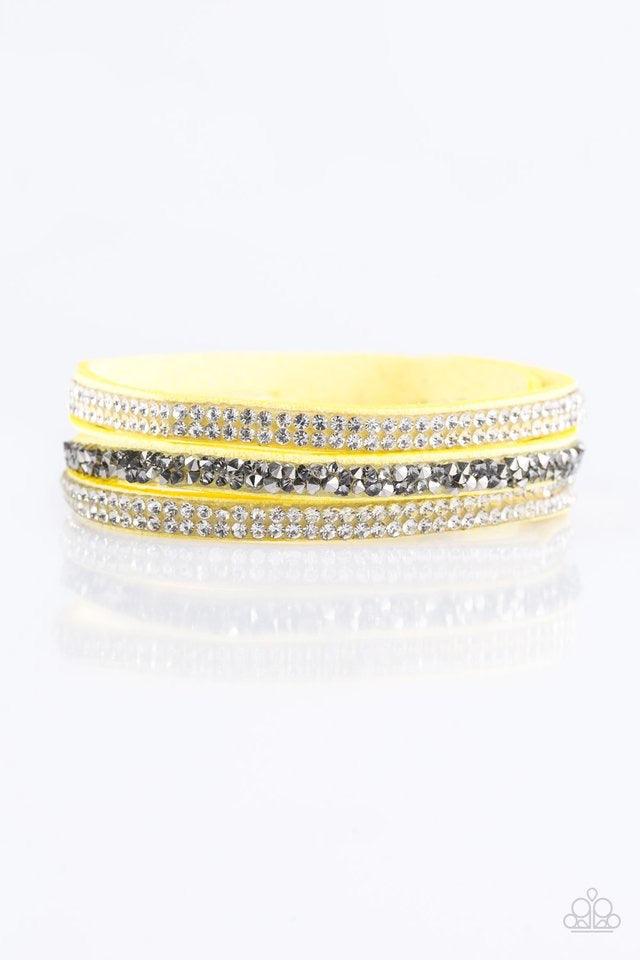 Paparazzi Accessories Mega Glam - Yellow Glittery white and glassy hematite rhinestones are sprinkled along three strands of bright yellow suede for a glamorous look. Features an adjustable snap closure. Jewelry