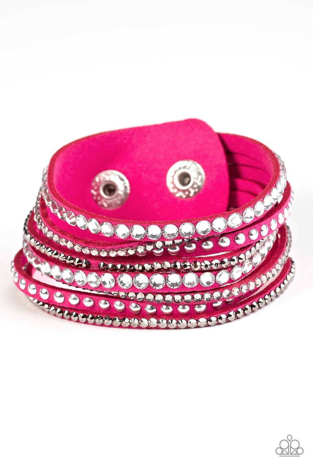 Paparazzi Accessories Guitars And Glitter - Pink A mishmash of smoky, white, and glittery hematite rhinestones are sprinkled along skinny strands of pink suede. Rows of shiny silver studs are added to the rock star palette for a shimmery metallic finish.