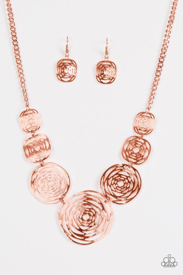 Paparazzi Accessories Cave Vogue ~Copper Delicately hammered in uneven surfaces, stenciled shiny copper frames link below the collar in a bold artisanal fashion. Features an adjustable clasp closure. Sold as one individual necklace. Includes one pair of m