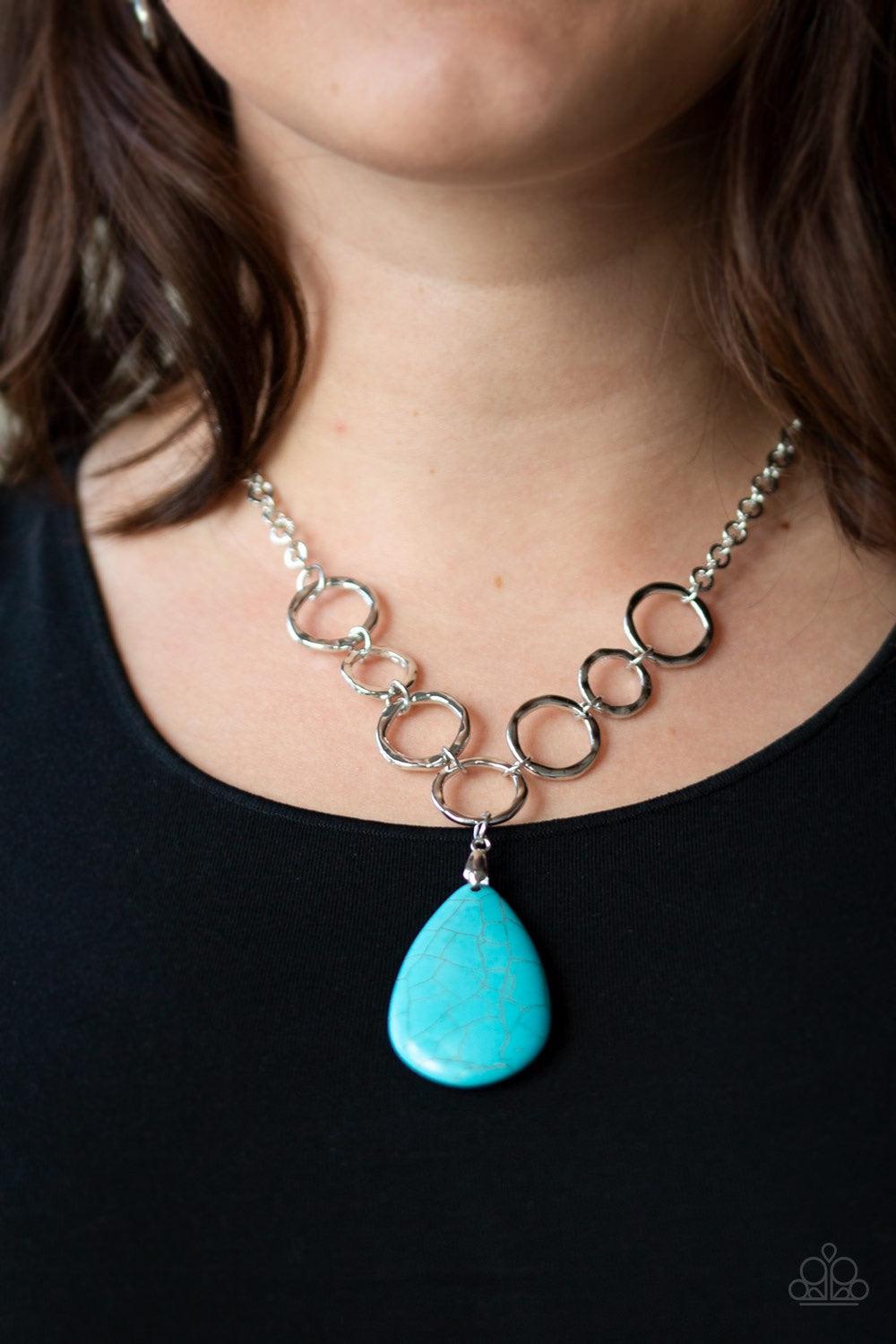 Paparazzi Accessories Livin on A Prairie - Blue A collection of silver links give way to a refreshing turquoise stone teardrop, creating a tranquil pendant below the collar. Each silver ring is hammered in texture, adding an artisanal touch to the piece.