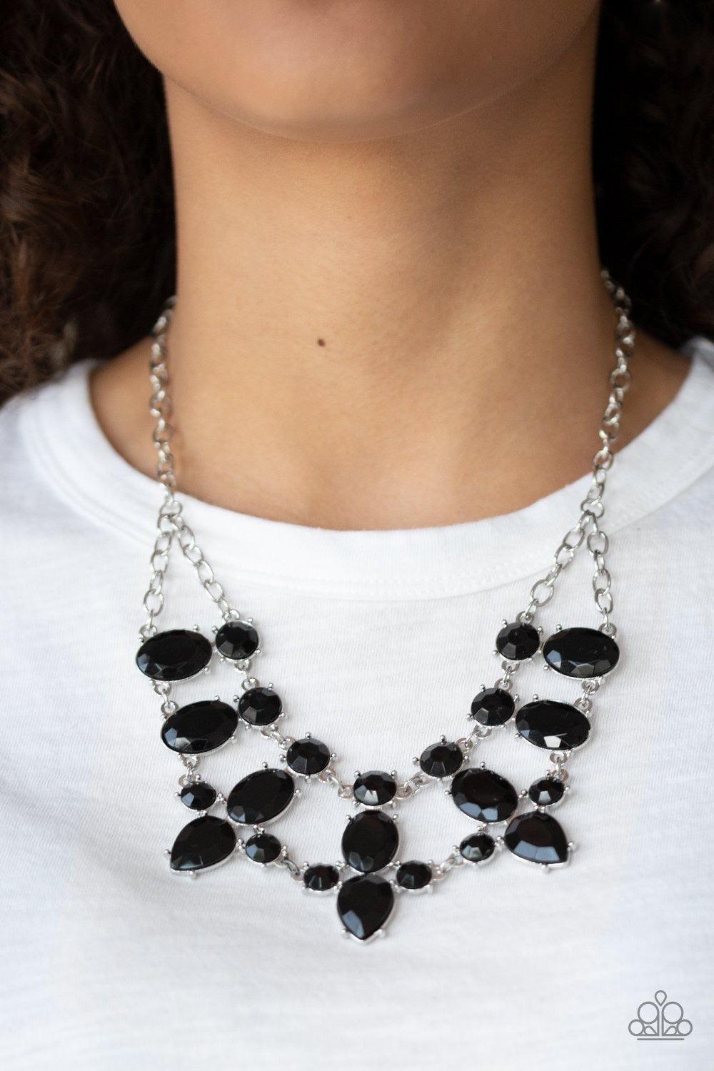 Paparazzi Accessories Goddess Glow - Black A collision of round, oval, and teardrop black rhinestone encrusted frames delicately connect below the collar for a glamorous look. Features an adjustable clasp closure. Sold as one individual necklace. Includes