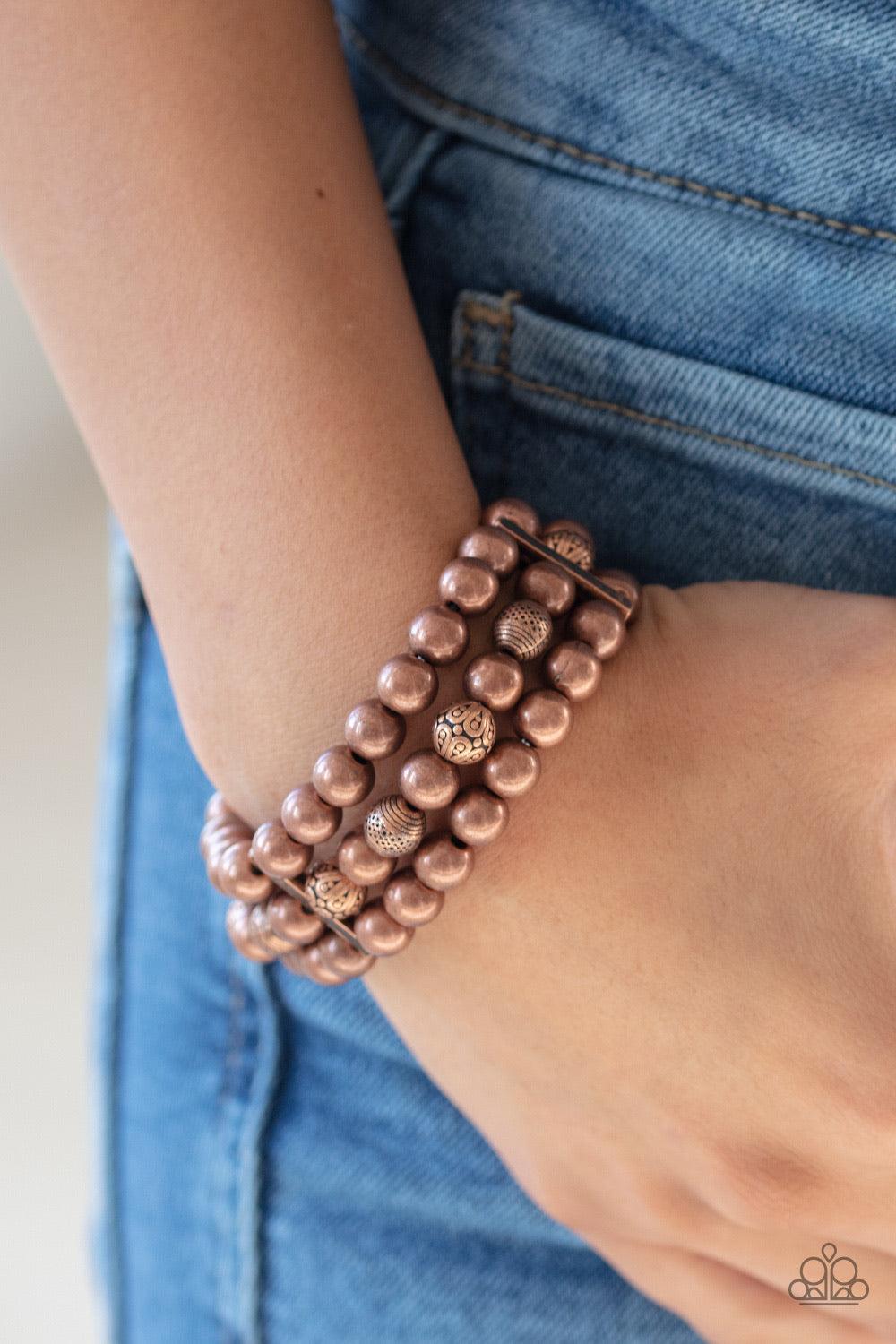 Paparazzi Accessories Trail Treasure - Copper Held together by dainty copper fittings, a collection of antiqued and decorative copper beads are threaded along stretchy bands around the wrist for a trendy layered look. Jewelry