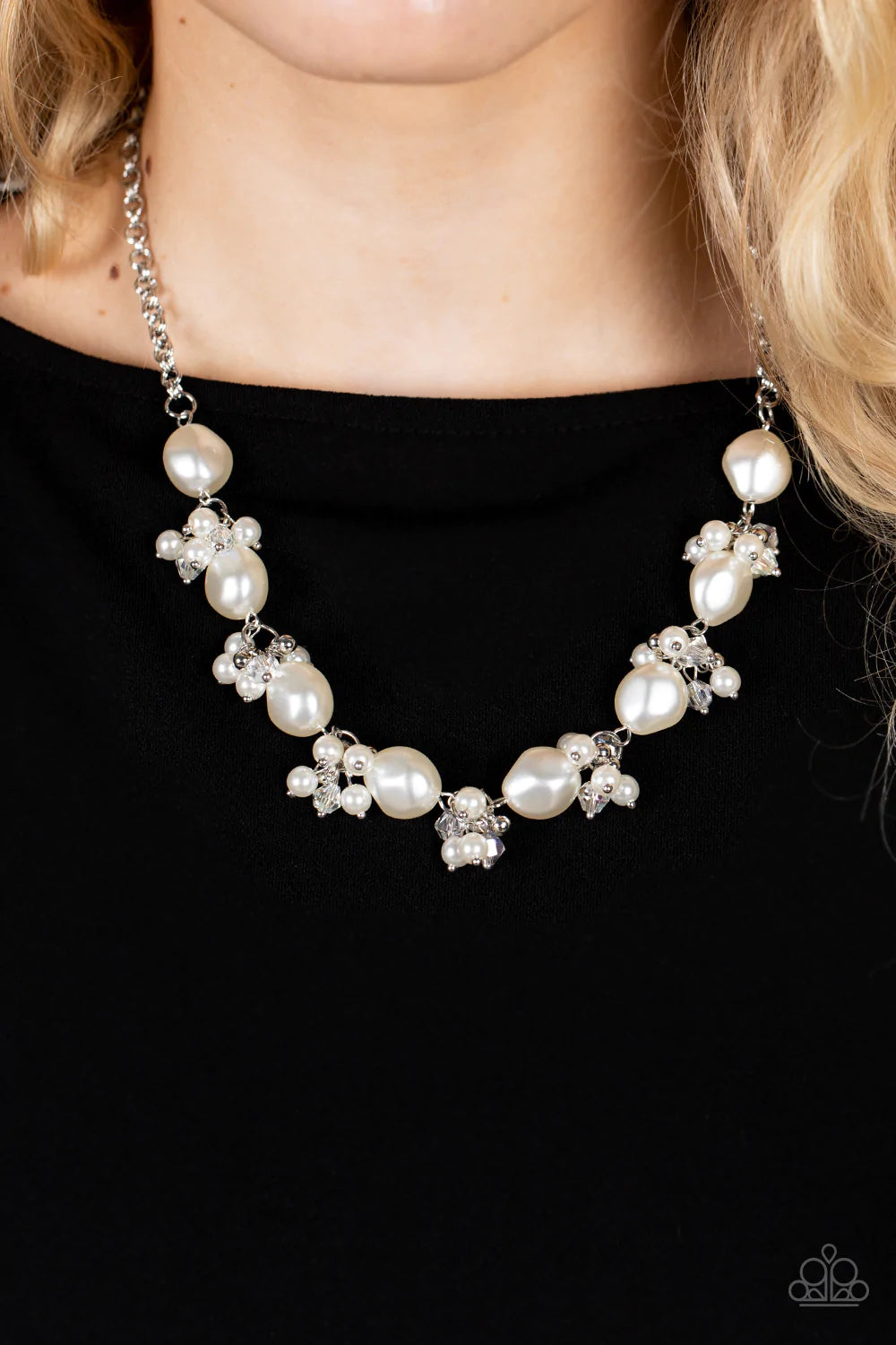 Paparazzi Accessories Rolling with the BRUNCHES - White An oval brown cat's eye gemstone sits atop a pronged silver frame along two layered silver bands, resulting in an enchanting centerpiece atop the finger. Features a stretchy band for a flexible fit.