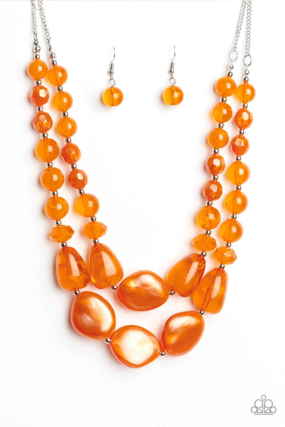 Paparazzi Accessories Beach Glam - Orange Varying in shape and opacity, a refreshing collection of glassy and iridescent Amberglow beads layer below the collar for a boldly colorful look. Features an adjustable clasp closure. Sold as one individual neckla