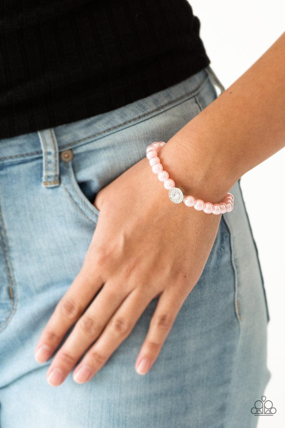 Paparazzi Accessories Follow My Lead - Pink Pink pearls and a white rhinestone encrusted silver charm are threaded along a stretchy band, creating a glamorous centerpiece atop the wrist. Sold as one individual bracelet. Jewelry