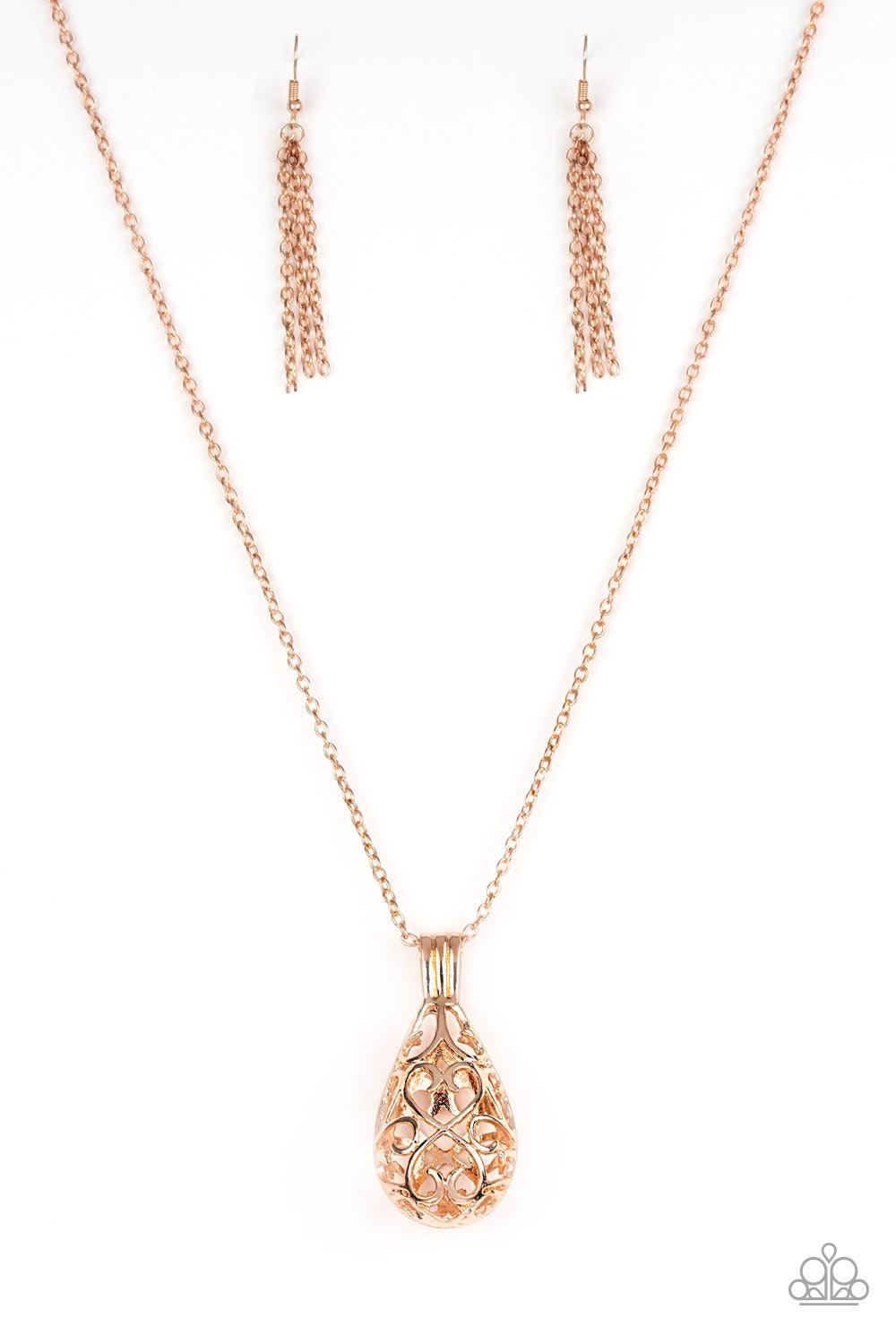 Paparazzi Accessories Magic Potions - Rose Gold Brushed in a high-sheen finish, shimmery rose gold filigree joins into an airy 3-dimensional pendant at the bottom of a lengthened rose gold chain for a whimsical look. Jewelry