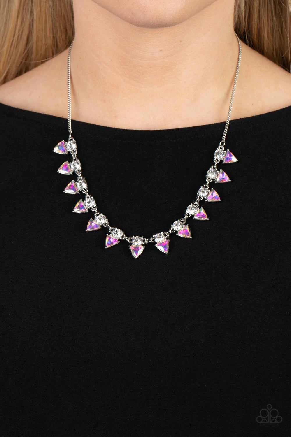 Paparazzi Accessories Razor-Sharp Refinement - Blue Solitaire white rhinestones sparkle atop iridescent prism-like gems below the collar, linking into a sharp-looking statement piece. Features an adjustable clasp closure. Due to its prismatic palette, col
