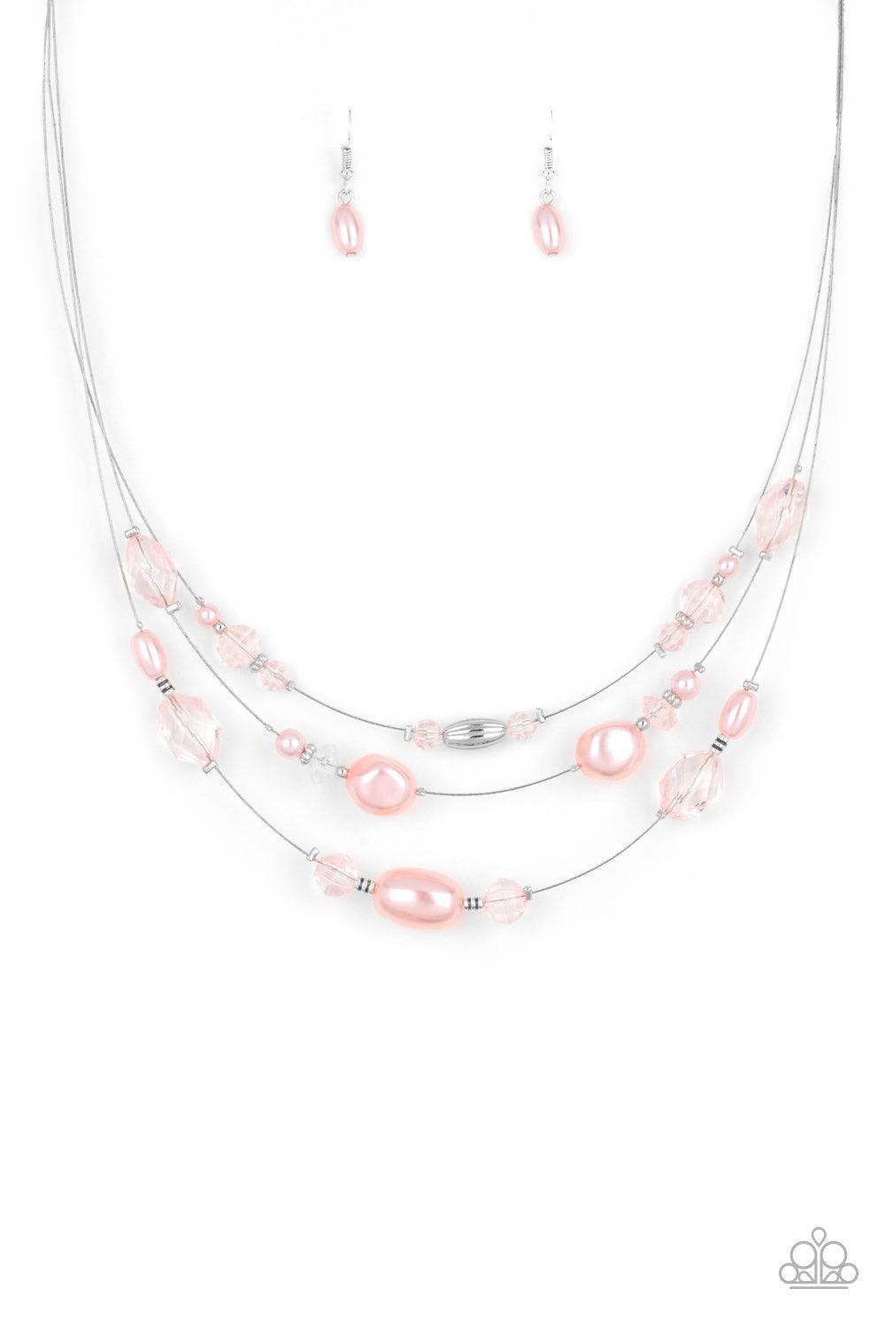 Paparazzi Accessories Pacific Pageantry - Pink An elegant collection of pearly pink, dainty silver, and pink crystal-like beads are fitted in place along three silver wires below the collar, creating the illusion of floating layers. Features an adjustable