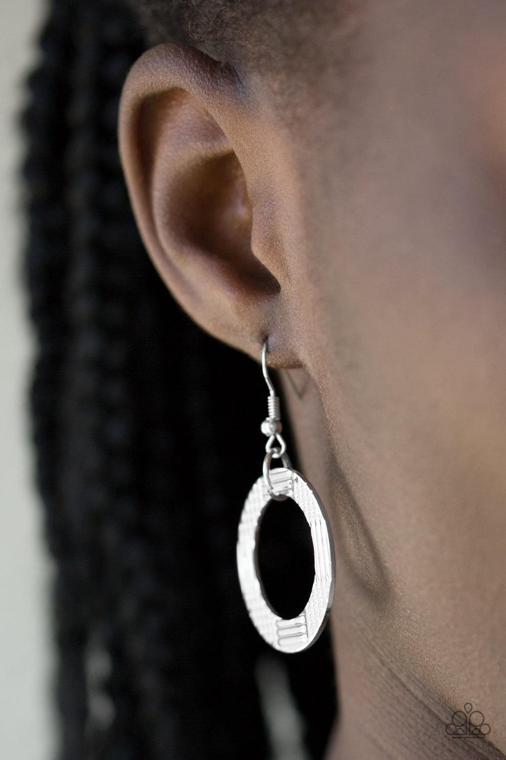 Paparazzi Accessories The Main Contender - Silver Etched and hammered in linear and diamond-cut shimmer, glistening silver circles interlock into a bold industrial chain below the collar. Features an adjustable clasp closure Jewelry