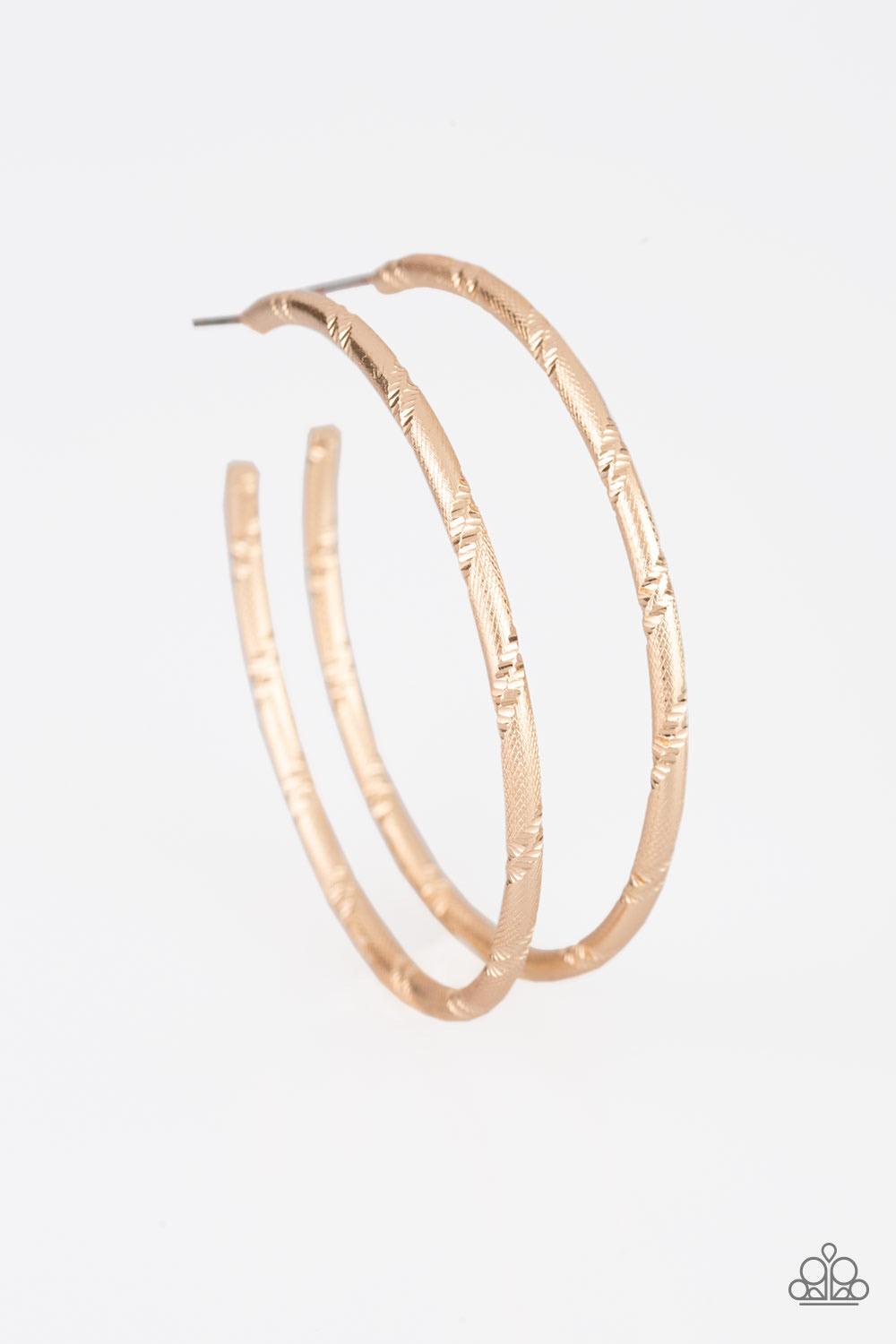 Paparazzi Accessories A Double Take - Gold Etched in ribbons of diamond-cut shimmer, a shiny gold hoop curls around the ear for a classic look. Earring attaches to a standard post fitting. Hoop measures 2 1/4" in diameter. Sold as one pair of hoop earring
