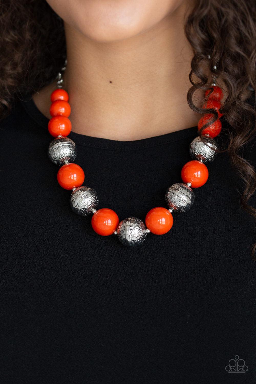 Paparazzi Accessories Floral Fusion - Orange Infused with dainty silver accents, a bubbly collection of hearty orange beads and floral embossed silver beads are threaded along an invisible wire below the collar for a seasonal look. Features an adjustable