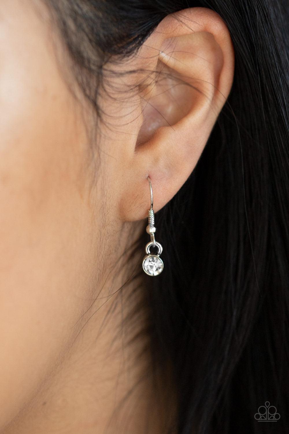 Paparazzi Accessories Locked In Love - Red Chiseled into a charming heart, an oversized red gem is pressed into a silver frame radiating with glassy white rhinestones, creating a glamorous pendant at the bottom of a lengthened silver chain. Features an ad