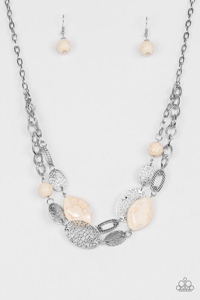 Paparazzi Accessories Second Nature - White Etched in shimmery textures, a chunky silver chain gives way to a collection of refreshing white stones and hammered silver accents. Each featuring patterns derived from nature, the glistening discs join into a