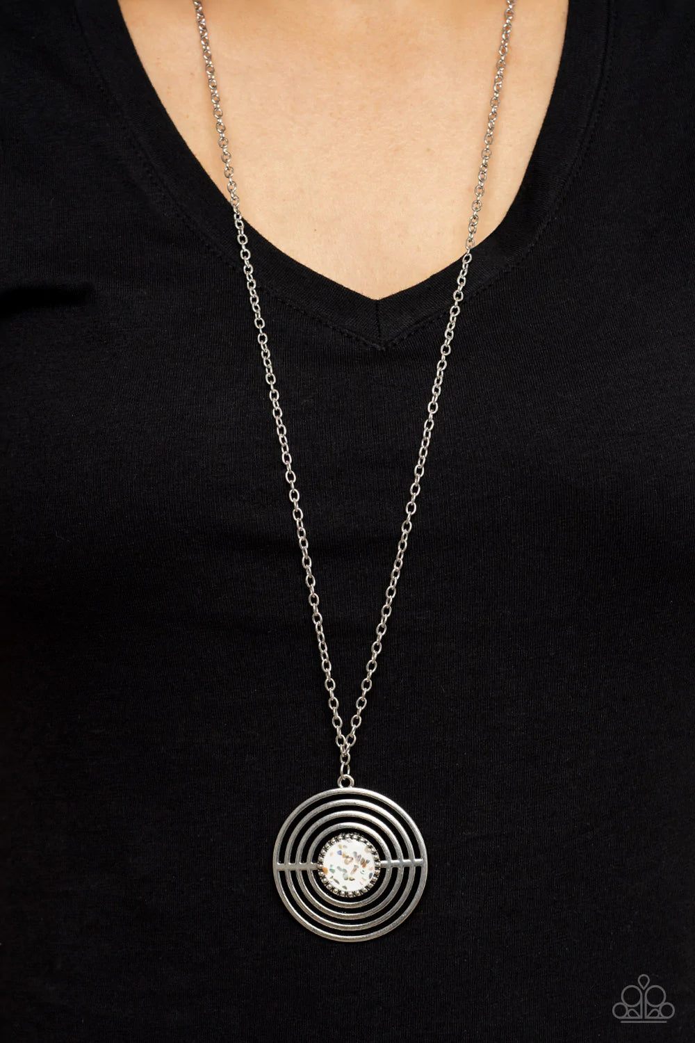 Paparazzi Accessories Targeted Tranquility - White Flecked in iridescent shell-like accents, a studded white frame adorns the center of an oversized silver pendant rippling with concentric circles at the bottom of an extended silver chain for a dizzying p