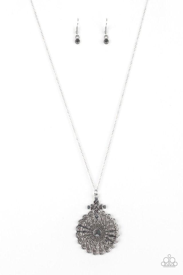 Paparazzi Accessories Walk on The WILDFLOWER Side - Silver Filigree filled petals flare from a glittery hematite rhinestone center, creating a whimsical floral pendant at the bottom of a lengthened silver chain. Features an adjustable clasp closure. Jewel