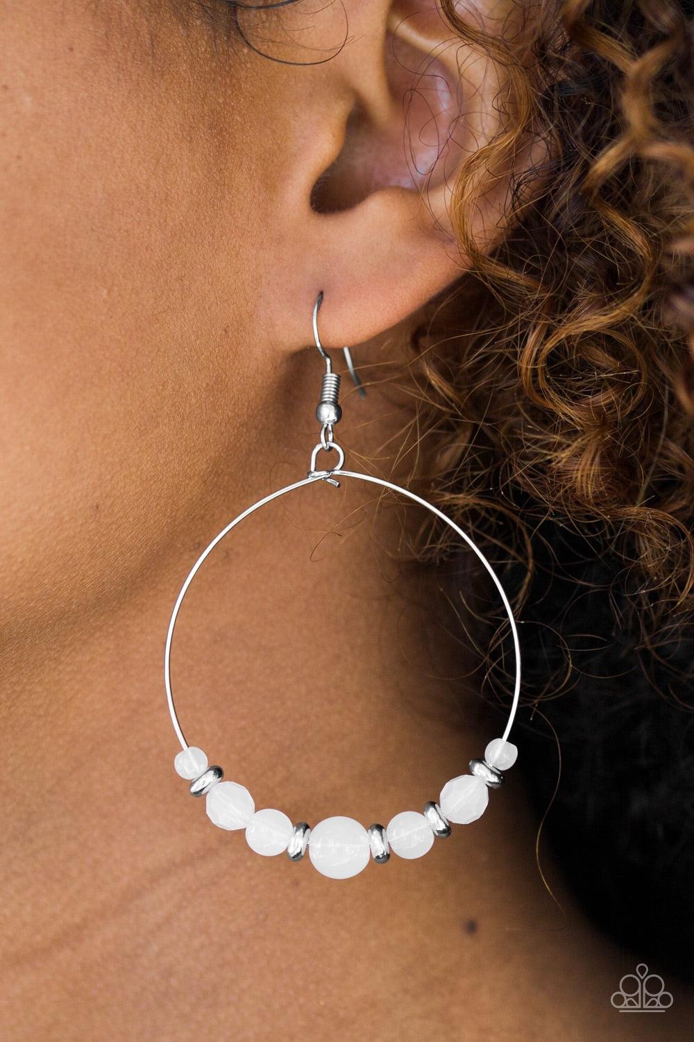 Paparazzi Accessories Going For GLOW - White Featuring an opaque finish, faceted and smooth white beads join shimmery silver accents along a silver hoop for a whimsical look. Earring attaches to a standard fishhook fitting. Jewelry