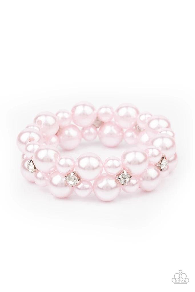 Paparazzi Accessories Flirt Alert - Pink A bubbly collection of pink pearls and classic white rhinestones are threaded along stretchy bands around the wrist, creating flirtatious refinement. Jewelry