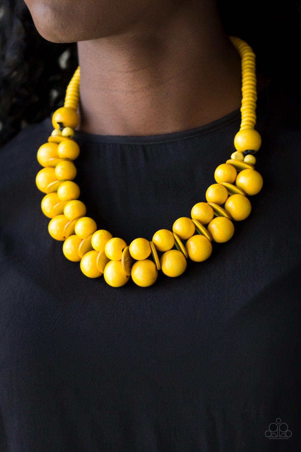 Paparazzi Accessories Caribbean Cover Girl - Yellow Brushed in a distressed finish, sunny yellow wooden beads and discs join below the collar for a summery look. Features a button loop closure. Jewelry