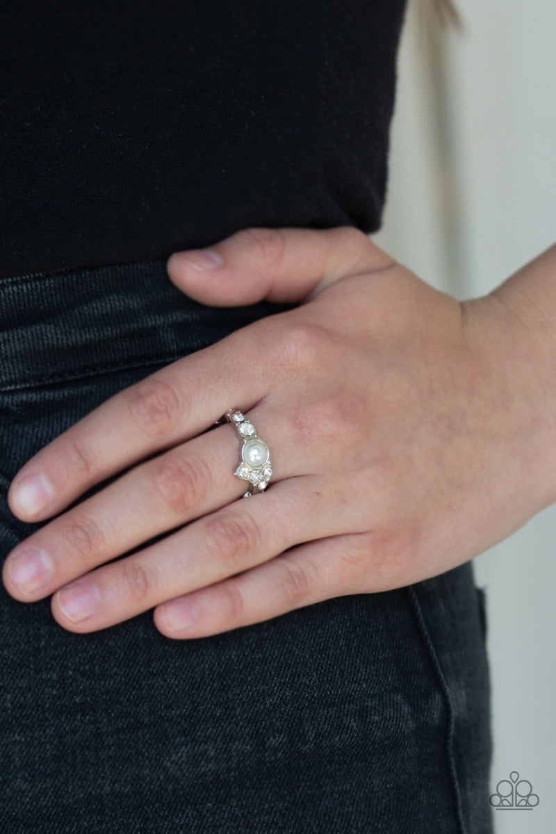 Paparazzi Accessories Center Stage Celebrity - White A dainty white pearl is pressed into an abstract white rhinestone encrusted band for a timeless twist. Features a dainty stretchy band for a flexible fit. Sold as one individual ring. Jewelry