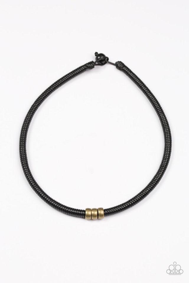 Paparazzi Accessories Trail Rules - Brass Shiny black twine wraps around a black cord, creating an urban look below the collar. Shiny brass beads slide along the cording for a rugged finish. Features a button loop closure. Sold as one individual necklace.