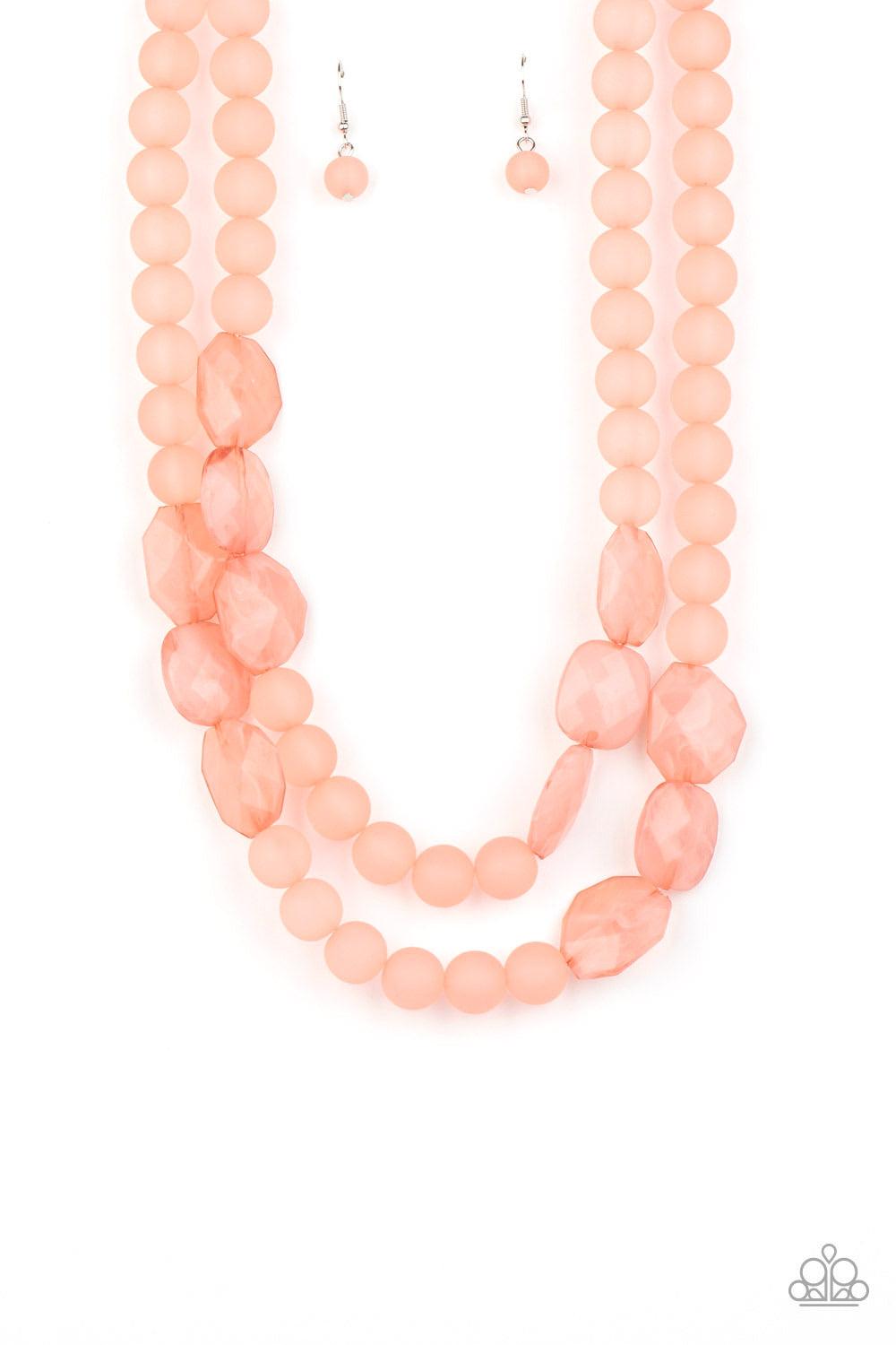 Paparazzi Accessories Arctic Art - Pink Featuring round and imperfectly flat shapes, an icy compilation of opaque Rose Tan beads are threaded along invisible wires, creating colorfully glassy layers below the collar. Features an adjustable clasp closure.