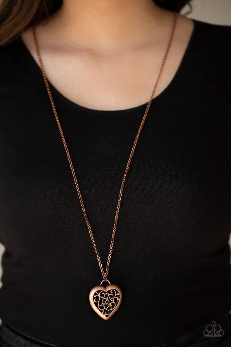 Paparazzi Accessories Victorian Valentine - Copper Featuring vine-like filigree, a dramatic locket-like heart swings from the bottom of a lengthened copper chain for a vintage inspired look. Features an adjustable clasp closure. Sold as one individual nec