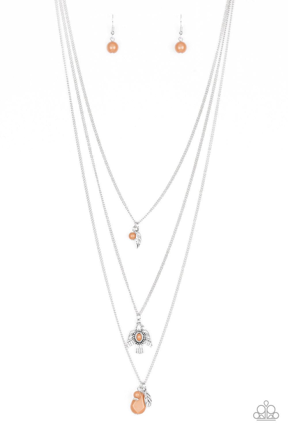Paparazzi Accessories Soar With The Eagles - Brown Infused with mismatched Meerkat beading, a shimmery silver feather charm and decorative eagle pendant layer down the chest for a colorful Southwestern inspired look. Features an adjustable clasp closure.