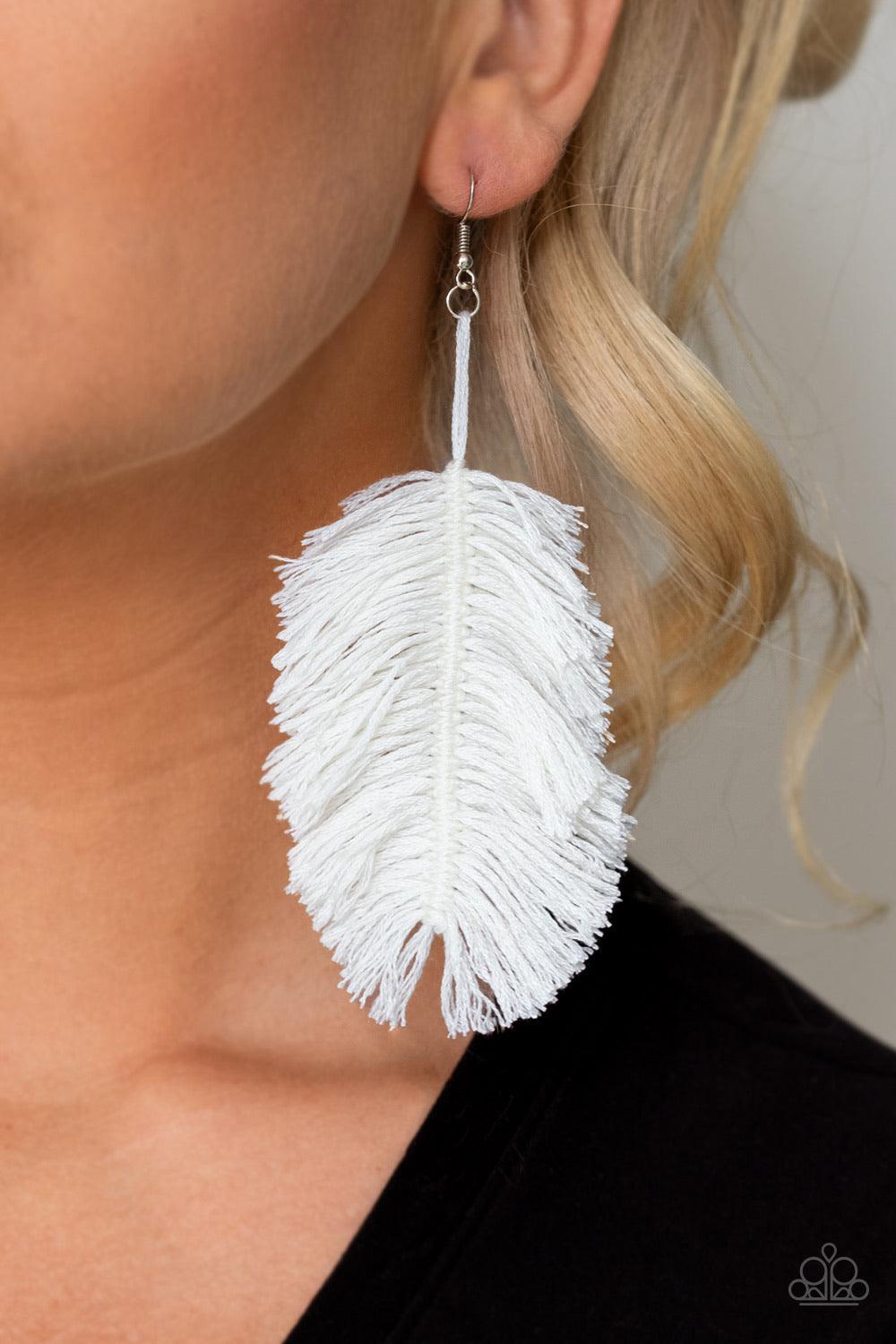 Paparazzi Accessories Hanging By A Thread - White Featuring a refreshing white hue, a loop of thread gives way to a leafy white fringe, creating a statement-making texture. Earring attaches to a standard fishhook fitting. Sold as one pair of earrin Jewelr