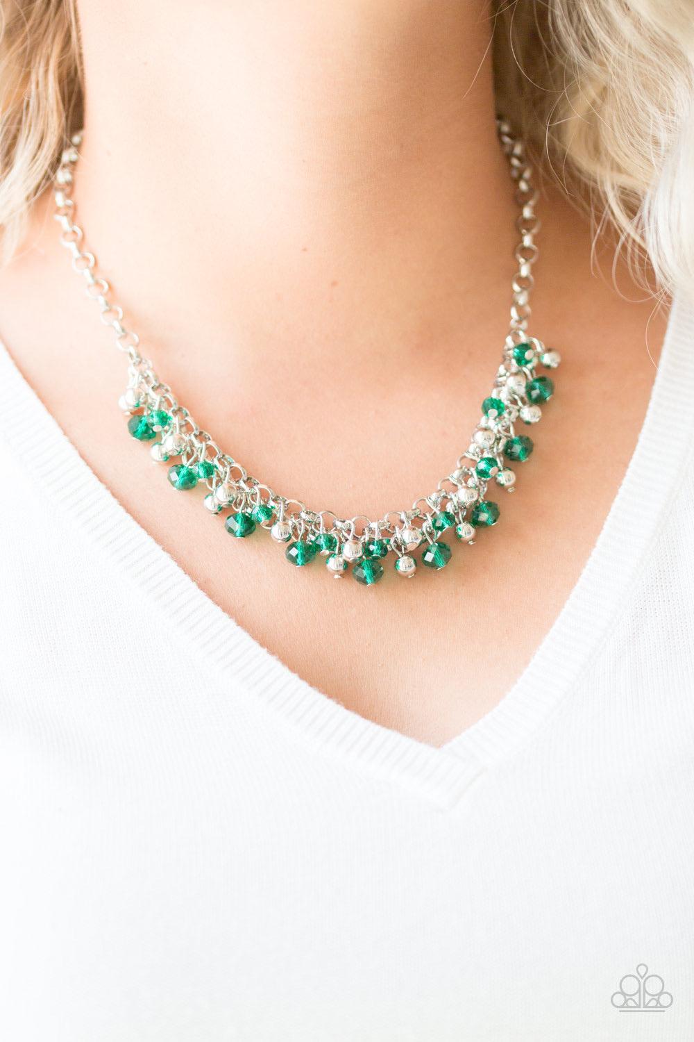 Paparazzi Accessories Trust Fund Baby ~Green Faceted green crystal-like beads and classic silver beads swing from interlocking silver chains, creating a refined fringe below the collar. Features an adjustable clasp closure.