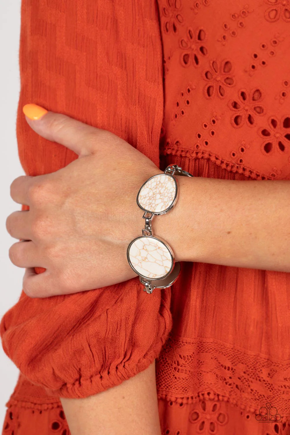 Paparazzi Accessories Flat Out Frontier - White Flat white marbled stones pressed into shiny-silver frames provide a statement focal point around the wrist. Features an adjustable clasp closure. As the stone elements in this piece are natural, some color