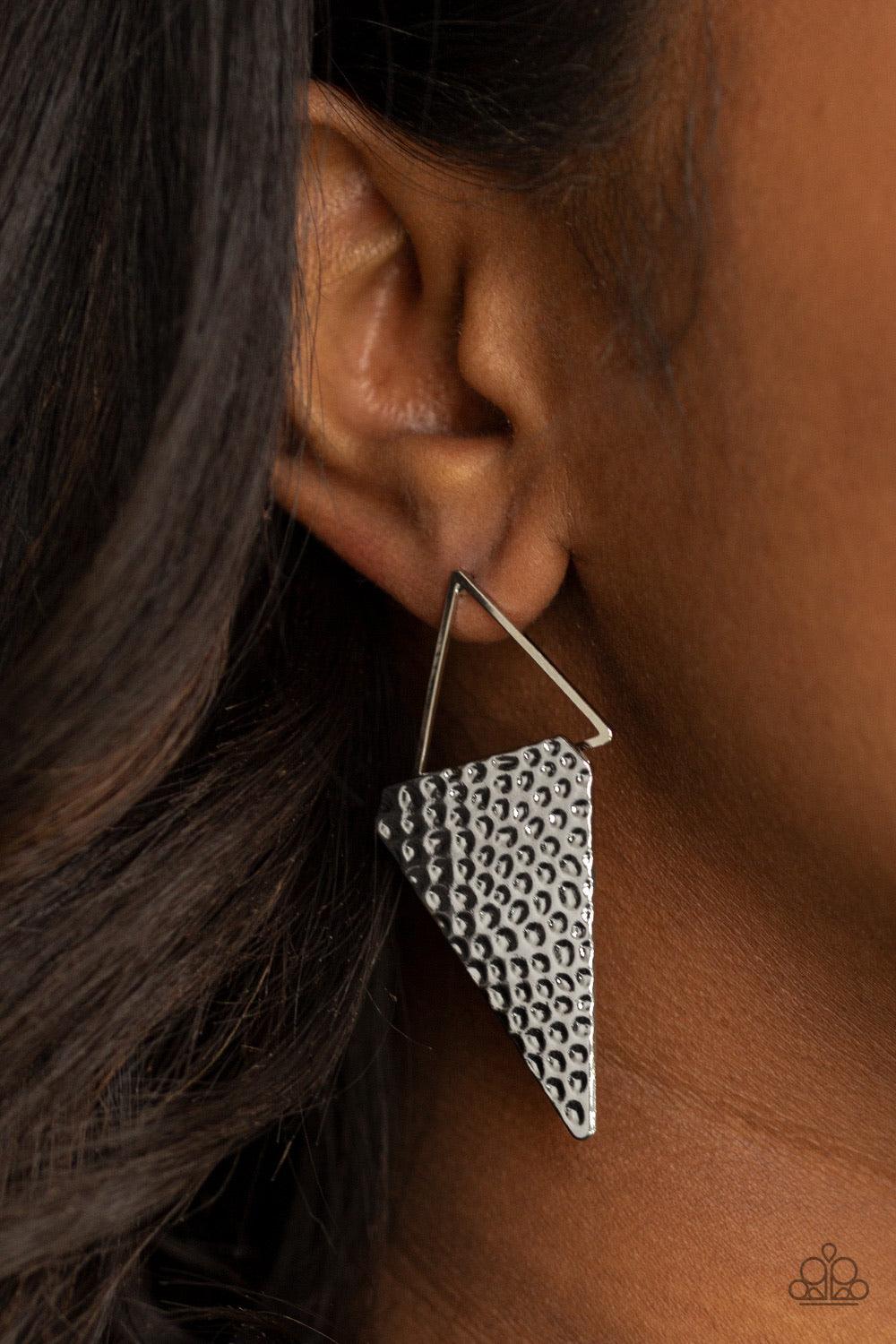 Paparazzi Accessories Have A Bite - Silver A hammered triangular frame attaches to a glistening silver triangular silhouette, creating an edgy lure. Earring attaches to a standard post fitting. Sold as one pair of post earrings. Jewelry