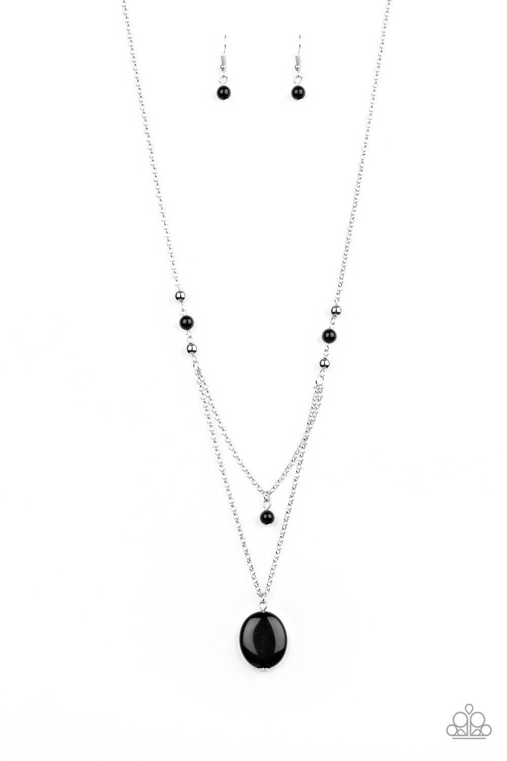 Paparazzi Accessories Time To Hit The ROAM - Black Rows of dainty silver and glassy black beads give way to two shimmery silver chain layers. A dainty black bead swings from the uppermost strand, while a glassy black stone pendant swings from the lowermos