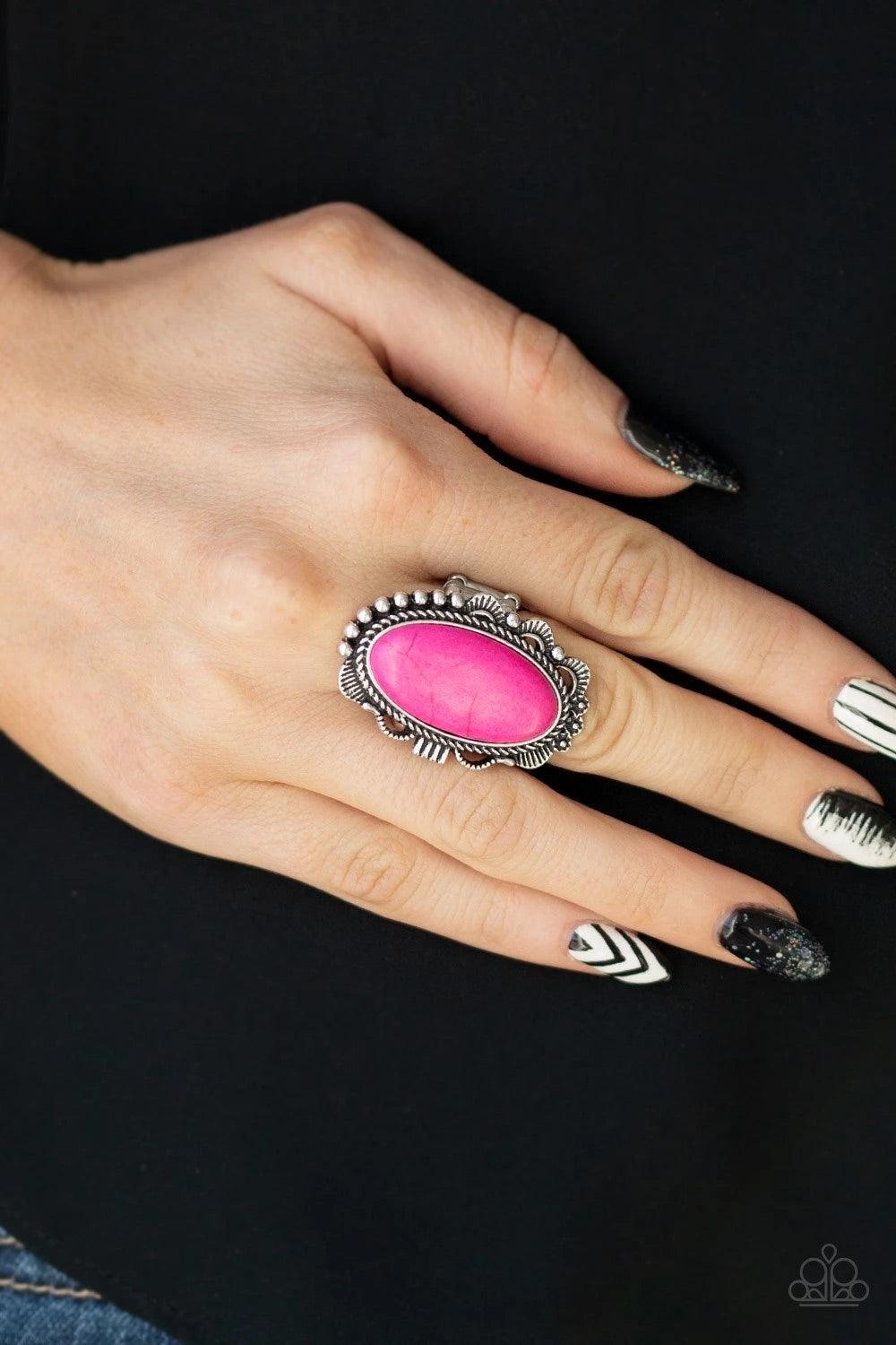 Paparazzi Accessories Open Range - Pink A vivacious pink stone is pressed into an ornate silver frame rippling with studded and serrated textures for a seasonal flair. Features a stretchy band for a flexible fit. Sold as one individual ring. Jewelry