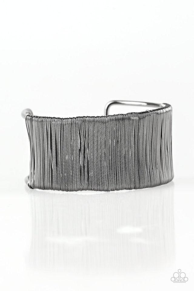 Paparazzi Accessories Metal Mecca - Black Shiny gunmetal wire wraps around the center of an airy gunmetal frame, creating a bold industrial cuff. Jewelry