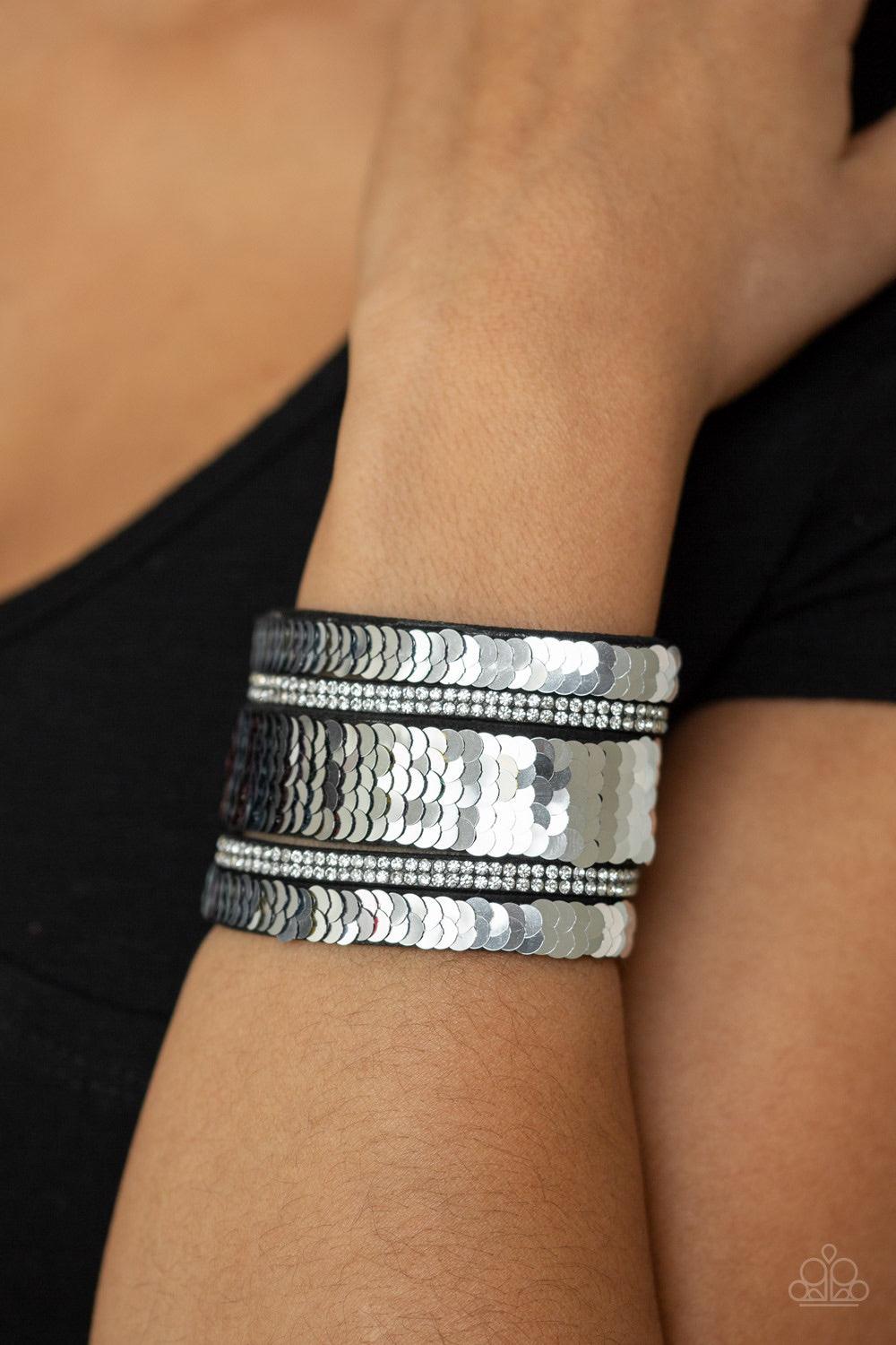 Paparazzi Accessories MERMAID Service - Multi Infused with strands of blinding white rhinestones, row after row of shimmery sequins are stitched across the front of a spliced black suede band. Bracelet features reversible sequins that change from silver t