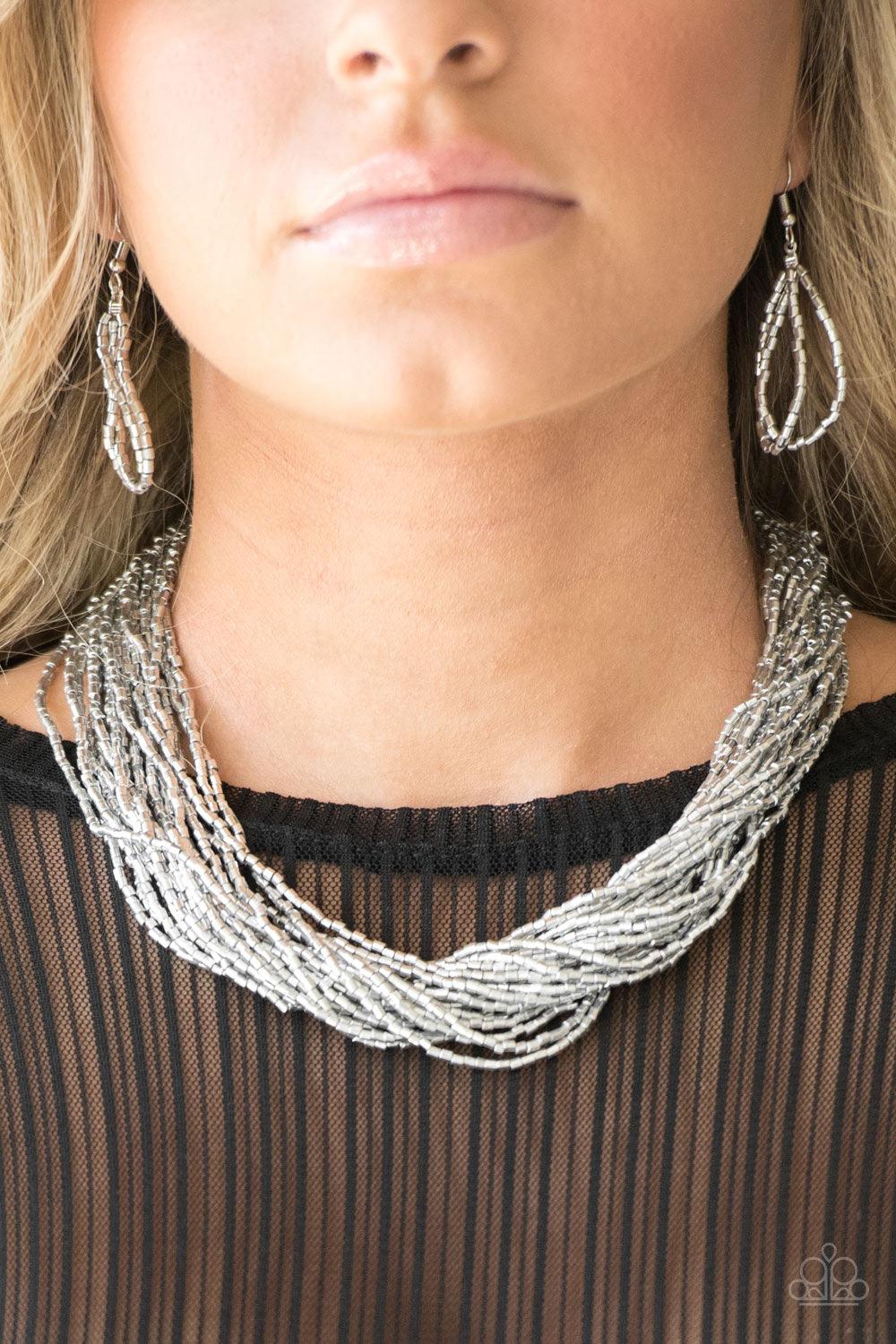 Paparazzi Accessories The Speed of STARLIGHT - Silver Strands of glistening silver seed beads subtlety twist below the collar, coalescing into a blinding shimmer. Features an adjustable clasp closure. Sold as one individual necklace. Includes one pair of